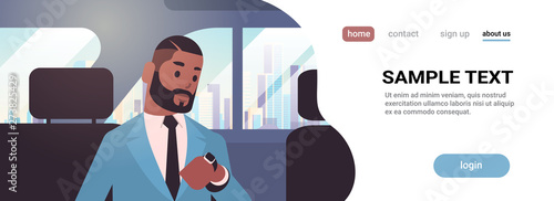 businessman looking at clock checking time african american passenger sitting on back seat in taxi cab city transportation service concept flat portrait horizontal copy space