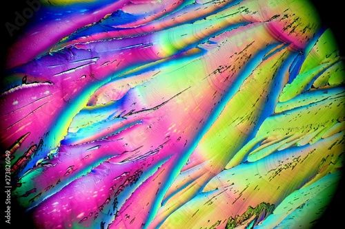 Fotografie Colorful apearence of crystals of citric acid, a food additive, in polarized light