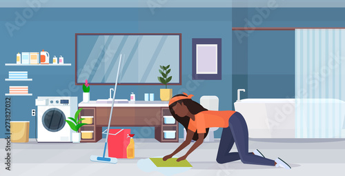 housewife washing floor on knees african american woman cleaner using cloth and bucket girl doing housework cleaning service concept modern bathroom interior full length flat horizontal