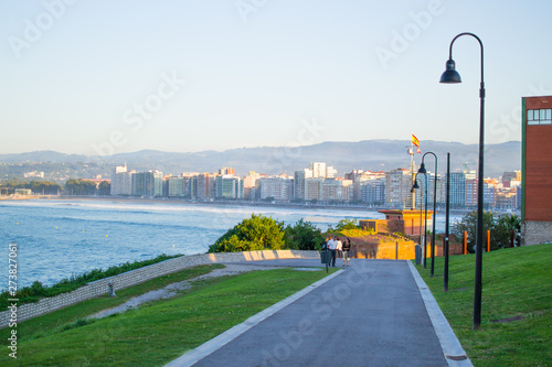 View of Gijon and Cantabrian Sea from Cerro de Santa Catalina, in Asturias, Spain. Green park and hill photo