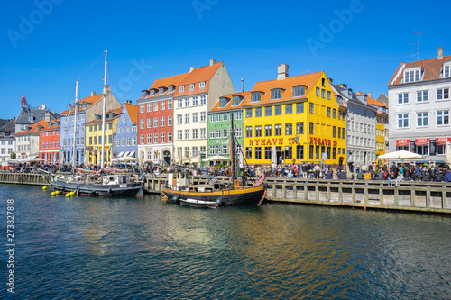 View of Nyhavn pier with color buildings in Copenhagen city, Denamrk