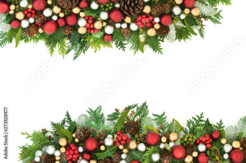 Wallpaper Mural Festive Christmas background border with red, silver and gold bauble decorations and winter flora with pine cones on white with copy space.  Torontodigital.ca