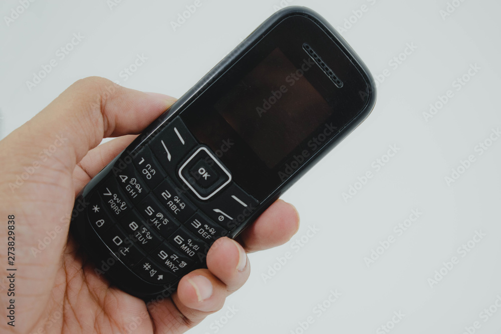 mobile phone in hand isolated on white background mobile phone in hand isolated on white background