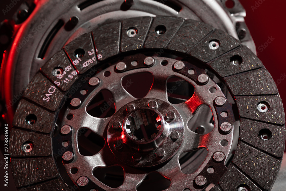 Close-up shot of clutch disk and basket on dark background Close-up shot of clutch disk and basket on dark background