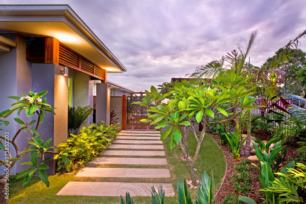 Modern house garden with colorful illumination under the  sky