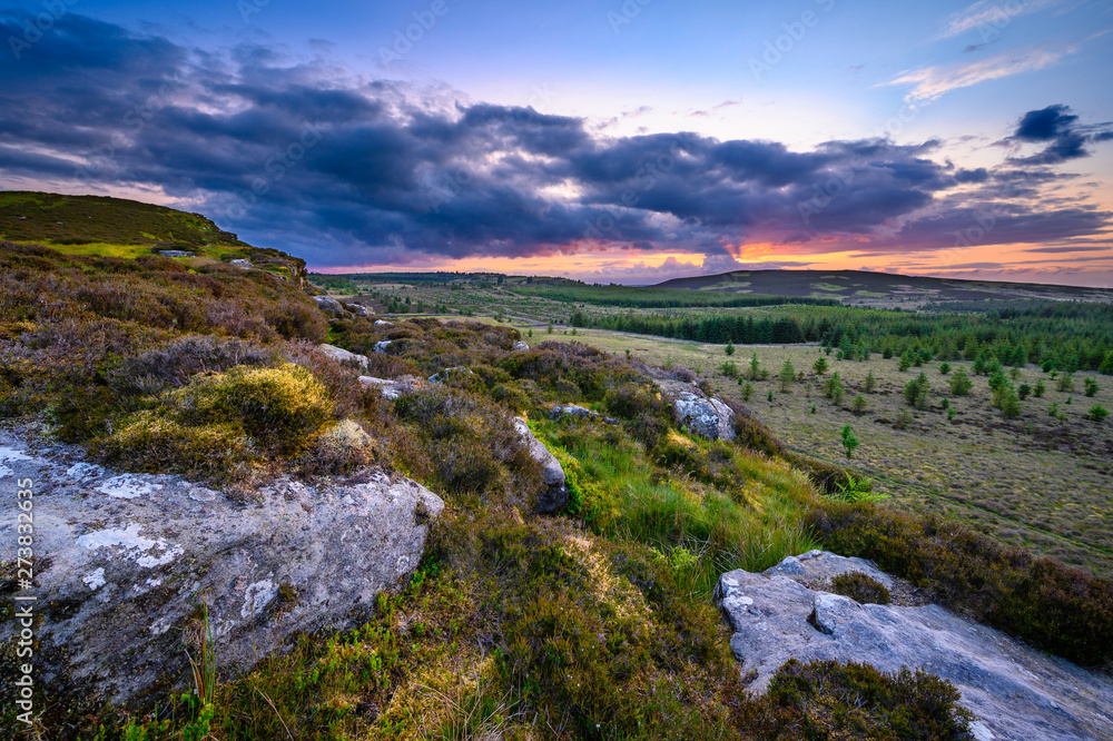Sunset viewed from top of Great Wanney Crag, on the edge of Northumberland National Park, is a remote escarpment popular for rock climbing and walking Sunset viewed from top of Great Wanney Crag, on the edge of Northumberland National Park, is a remote escarpment popular for rock climbing and walking