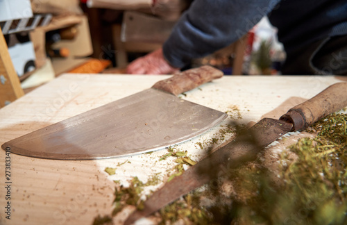 Kitchen knives used on wooden board. Rural.