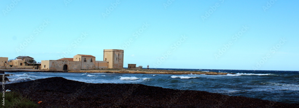 Fototapeta premium fantastic image of a tuna factory by the rough sea in Sicily