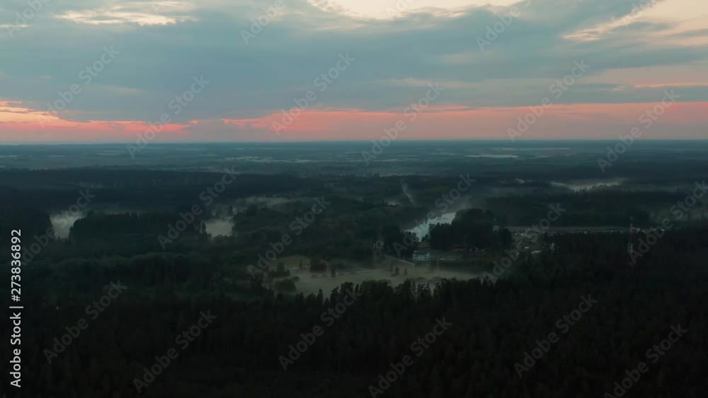 Aerial view of a rural landscape. Foggy evening / dusk. 4k footage. Aerial view of a rural landscape. Foggy evening / dusk. 4k footage.