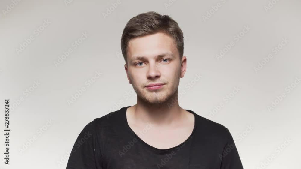 Man with tanned skin showing dislike. Close up portrait. Isolated Man with tanned skin showing dislike. Close up portrait. Isolated