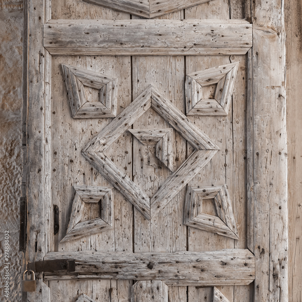 background of old wooden door corroded by a bug close up background of old wooden door corroded by a bug close up