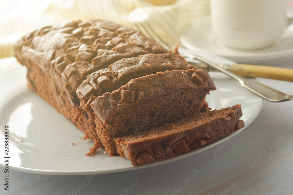 Chocolate pound cake. Homemade dark chocolate pastry for breakfast or dessert, bright background. Chocolate pound cake. Homemade dark chocolate pastry for breakfast or dessert, bright background.