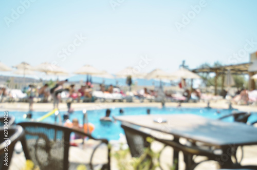 Abstract defocused and blur restaurant buffet and outdoor swimming pool in hotel resort for background. Image