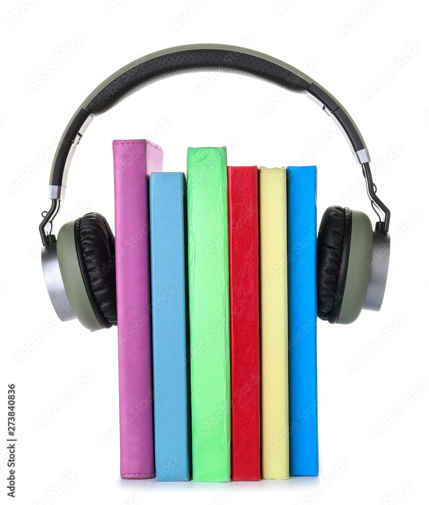 Books and modern headphones on white background. Concept of audiobook Books and modern headphones on white background. Concept of audiobook