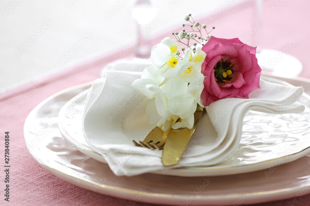 Beautiful table setting with fresh freesia flowers, closeup