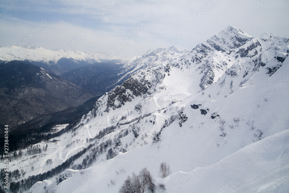 Fototapeta premium mountains in the snow on a background of clouds