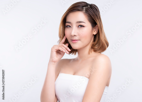 Beauty Young asian woman with perfect facial skin. Gestures for advertisement treatment spa and cosmetology.