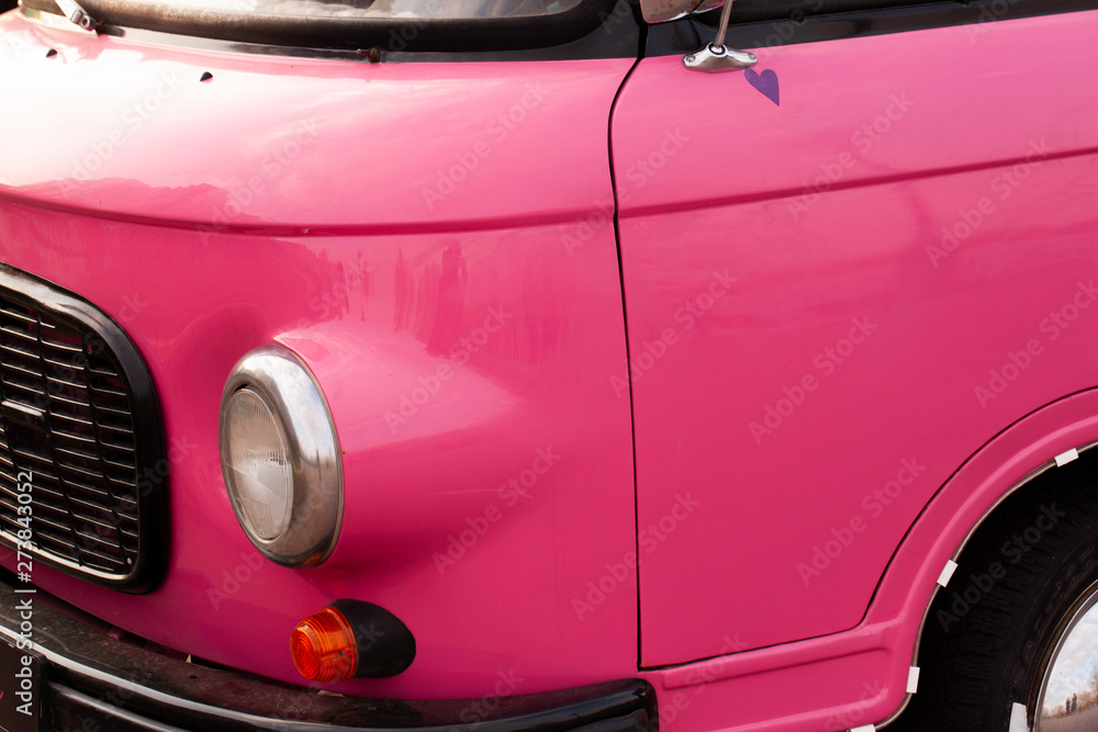 Retro pink car close up.