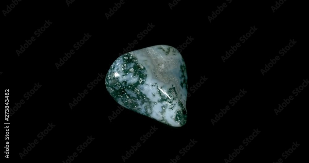 Moss Agate Mineral Turning on Black Moss Agate Mineral Turning on Black