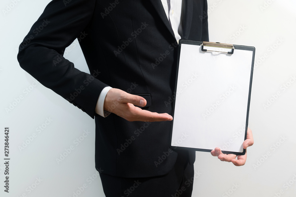 young business man wearing a suit while holding sign board, clip