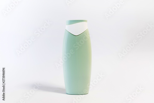 Fototapeta Naklejka Na Ścianę i Meble -  Blank plastic shampoo bottle on white background. Copy space for