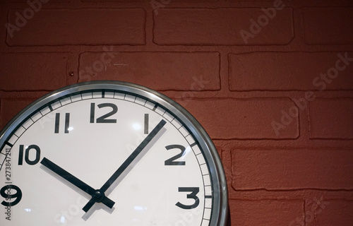 Wallpaper Mural Classic clock with a white dial and black arrows on the background of a red brick wall. Torontodigital.ca