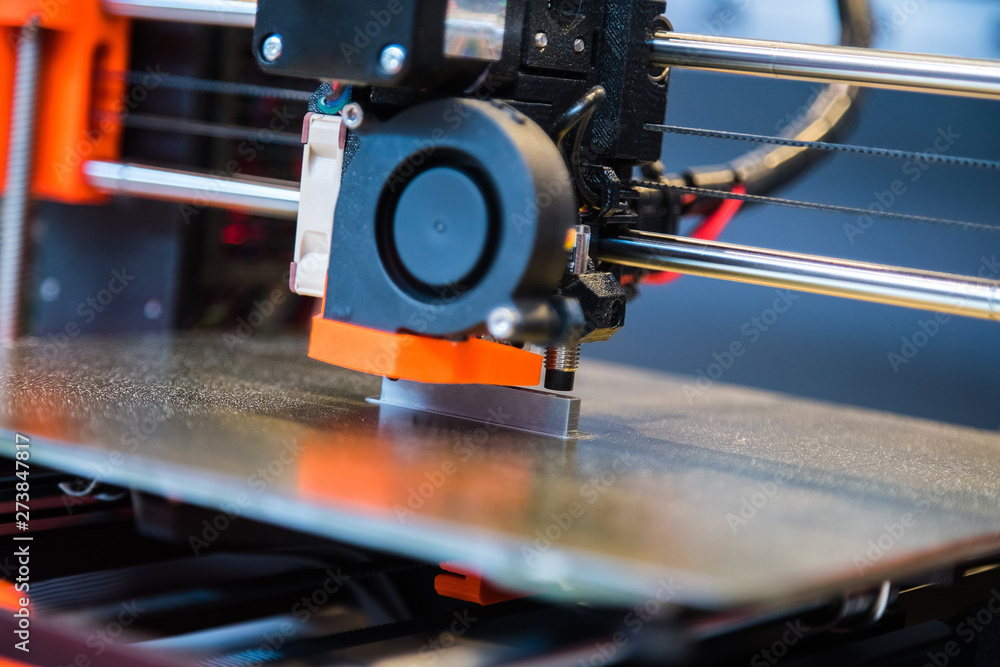 Obraz premium Automatic three dimensional 3d printer performs product creation. Modern 3D printing or additive manufacturing and robotic automation technology