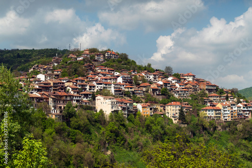 Homes on the cliff among the mountain scenery. Balkan houses