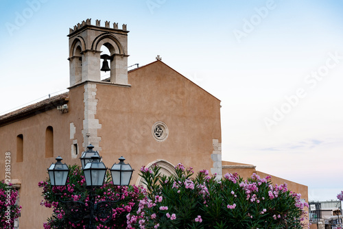 Piazza IX Aprile in Taormina, in the background the church bell tower photo