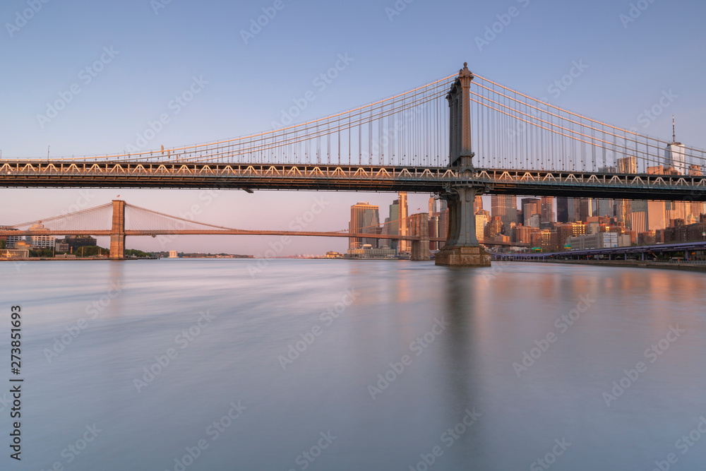 East riVer View at sunrise with Dumbo, Manhattan Bridge,  Brooklyn bridge and Financial District with long exposure photo