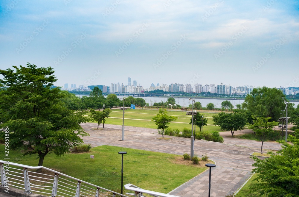 River Park view on a cloudy day with skylines of the other side of the river.