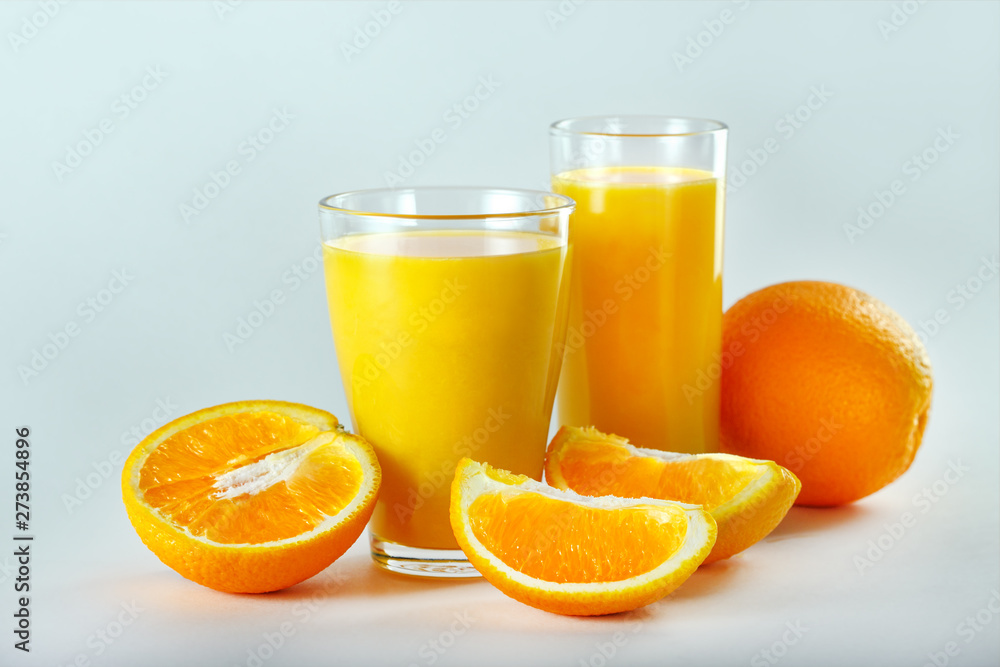 Two Glasses Of Orange Juice And Fruits. Two Glasses Of Orange Juice And Fruits.