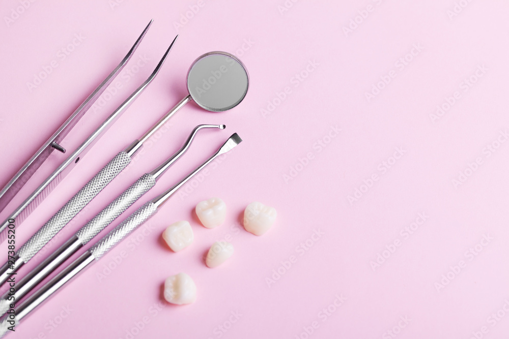 dental tools on pink background top view dental tools on pink background top view