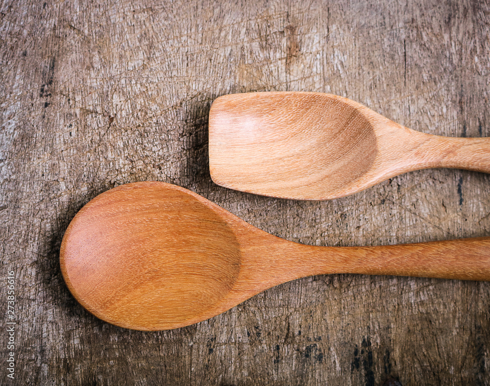 Handcrafted wooden spoons on rustic background. Handcrafted wooden spoons on rustic background.