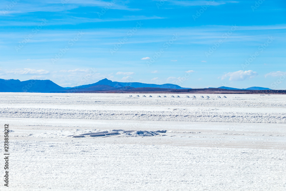Landscape of incredibly white salt flat Salar de Uyuni, amid the Andes in southwest Bolivia, South America