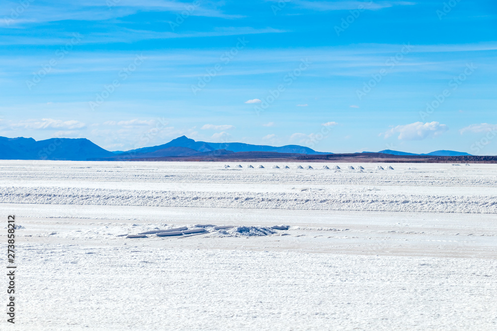 Landscape of incredibly white salt flat Salar de Uyuni, amid the Andes in southwest Bolivia, South America Landscape of incredibly white salt flat Salar de Uyuni, amid the Andes in southwest Bolivia, South America