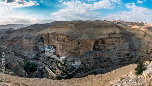 Monastery of St. George Hosevit over the cliff in the gorge of Wadi Kelt. The Jewish wilderness not far from Jerusalem. photo