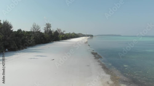 Wallpaper Mural Aerial: drone flying over tropical beach caribbean sea coral reef atoll in the Kei Islands Maluku Moluccas Indonesia scenic travel destination. Native cinelike D-log color profile Torontodigital.ca