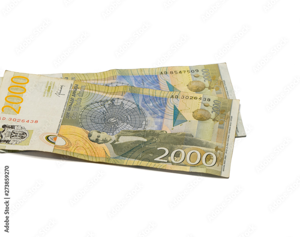Two banknotes worth 2000 Serbian Dinars with a portrait of a climate scientist Milutin Milankovic isolated on a white background Two banknotes worth 2000 Serbian Dinars with a portrait of a climate scientist Milutin Milankovic isolated on a white background