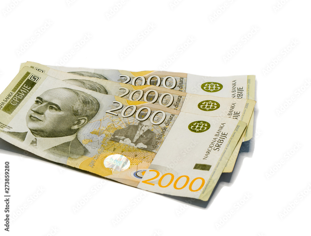 Fototapeta premium Three banknotes worth 2000 Serbian Dinars with a portrait of a climate scientist Milutin Milankovic isolated on a white background