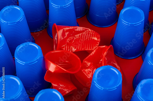 Plenty of plastic empty colorful cups close up