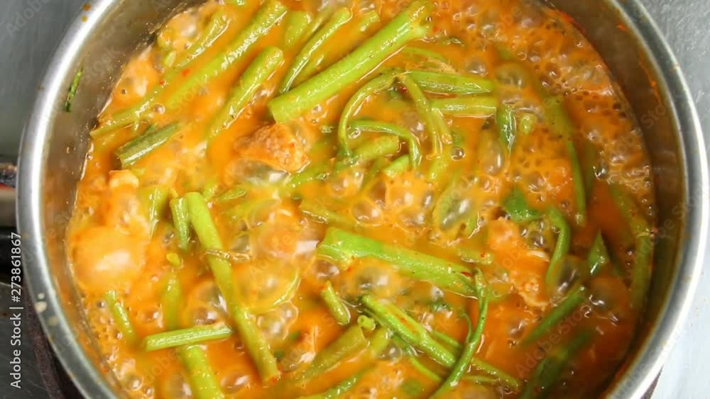 Cooking pork curry with water spinach, Thai famous food Cooking pork curry with water spinach, Thai famous food