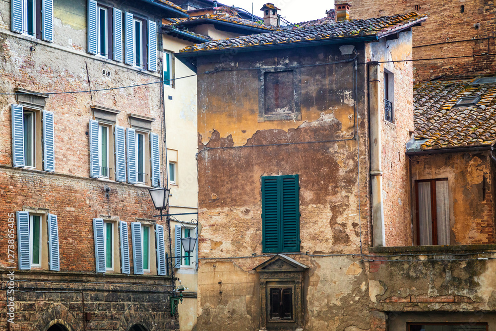Old houses of Siena town, an ancient city in the Tuscany region of Italy, Europe.