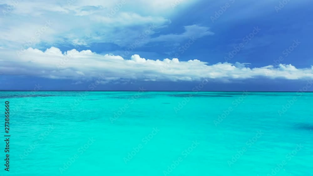 Crystal clear turquoise tropical sea water and blue sky with white clouds, horizon,Philippines,aerial dolly in shot Crystal clear turquoise tropical sea water and blue sky with white clouds, horizon,Philippines,aerial dolly in shot