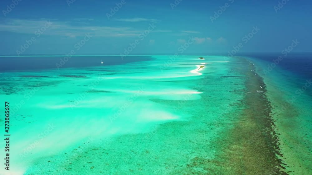 breathtaking aerial view of coral barrier reef in crystal clear Caribbean sea, with sandbanks and tropical uninhabited islands aerial drone establishing shot breathtaking aerial view of coral barrier reef in crystal clear Caribbean sea, with sandbanks and tropical uninhabited islands aerial drone establishing shot