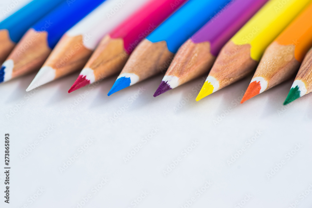 colored pencils on a pastel background to a point with space for text. colored pencils on a pastel background to a point with space for text.