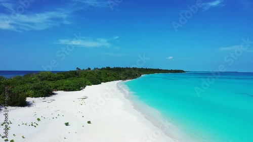 aerial drone pedestal down dolly in shot of tropical beach, scenic turquoise water and white sand, Tomia Island, Wakatobi marine national park, Indonesia, paradise travel location photo