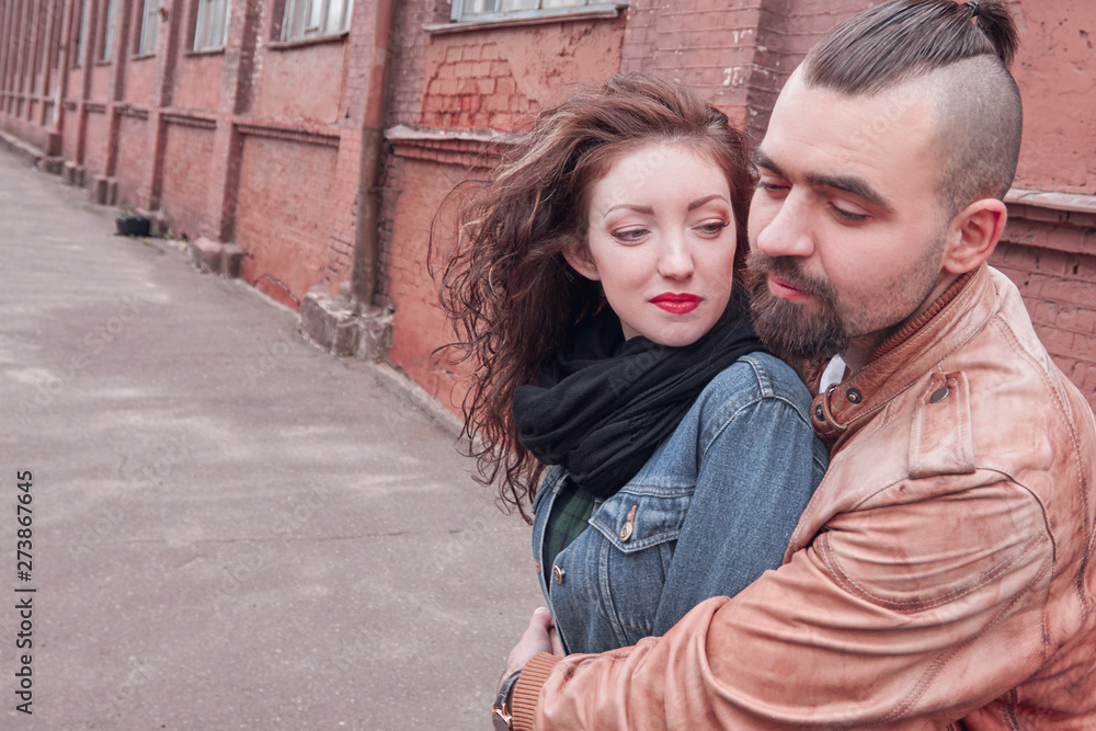 portrait of a happy loving couple on the background of an old city building