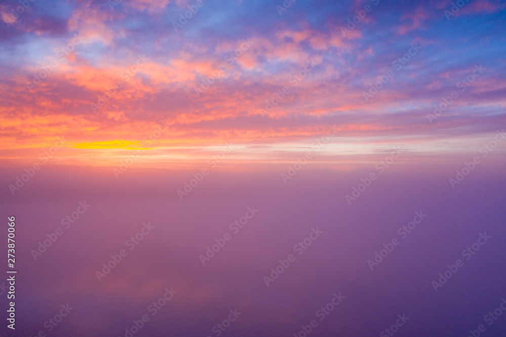 Beautiful sunset cloudy sky from aerial view.