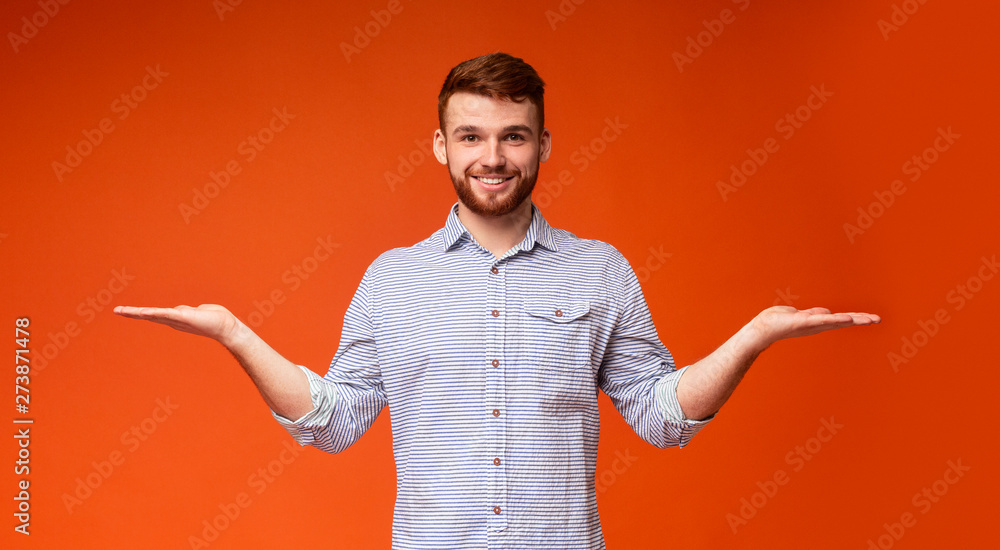 Young millennial guy propose to choose the best variant Young millennial guy propose to choose the best variant